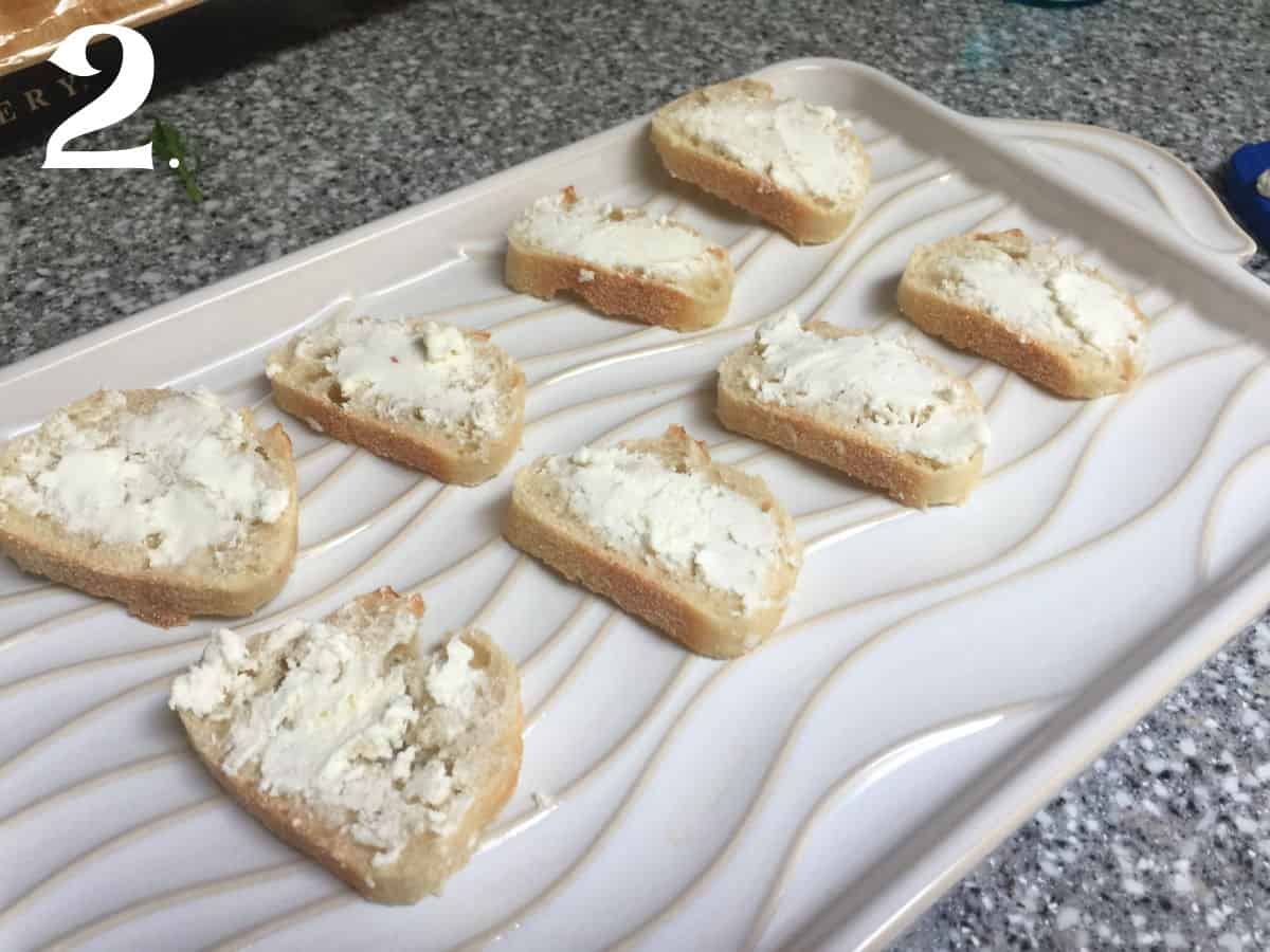 How To Make Strawberry Goat Cheese Crostini Step 2 - spread cream cheese on toasted bread.
