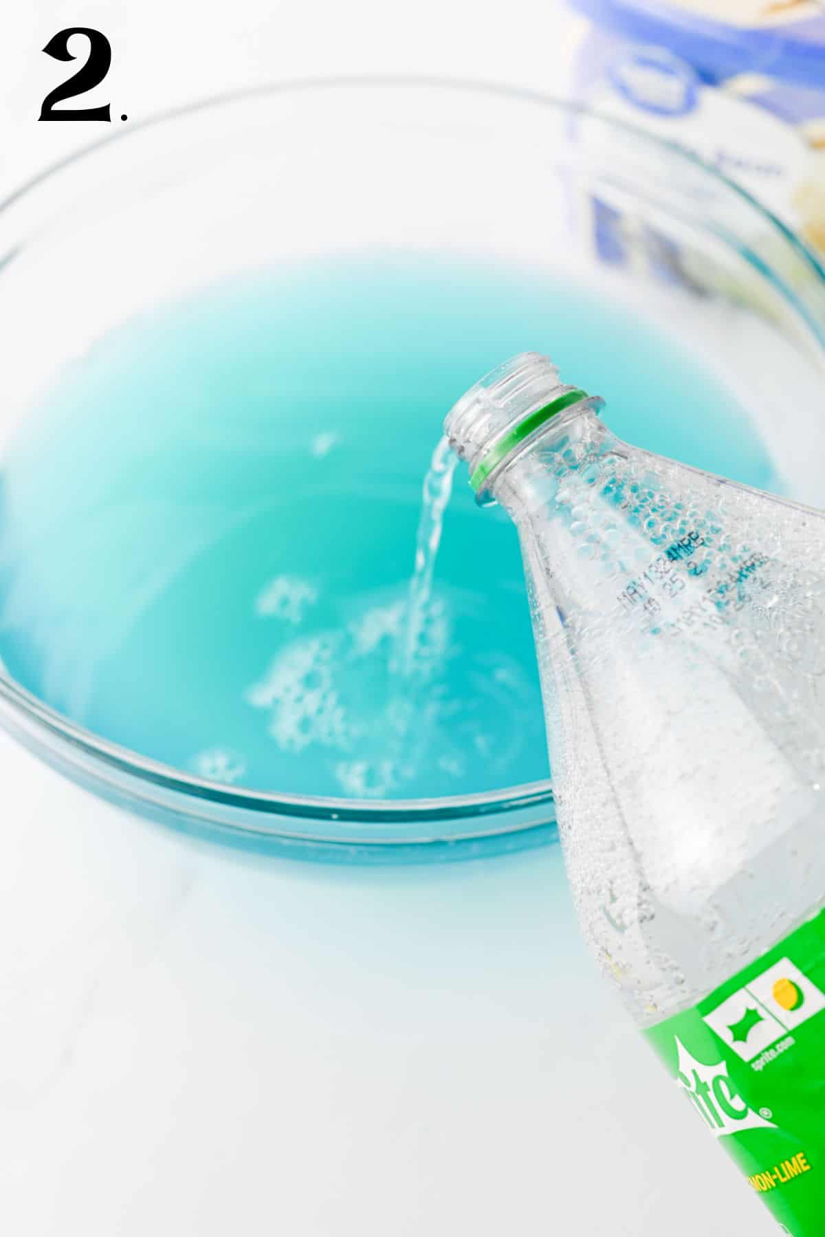 How to Make Blue Punch Step 2 - adding soda.