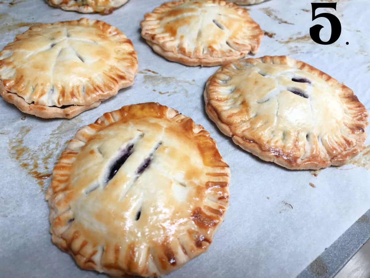 How to Make Blueberry Hand Pies Step 5 baked crusts on parchment lined sheet.