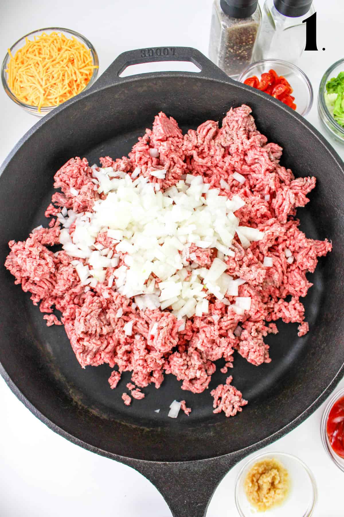 How to Make Cheeseburger Pasta - Step 1 - ground beef and onions in pan.
