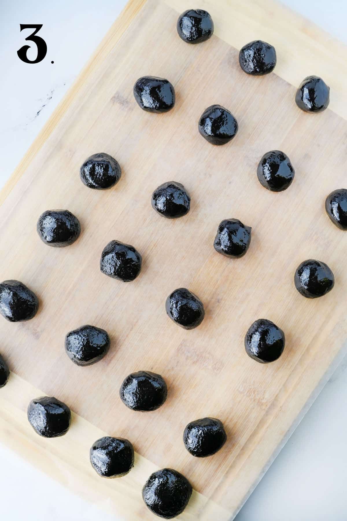How to Make Oreo Truffles - Step 3 oreo balls on baking sheet.