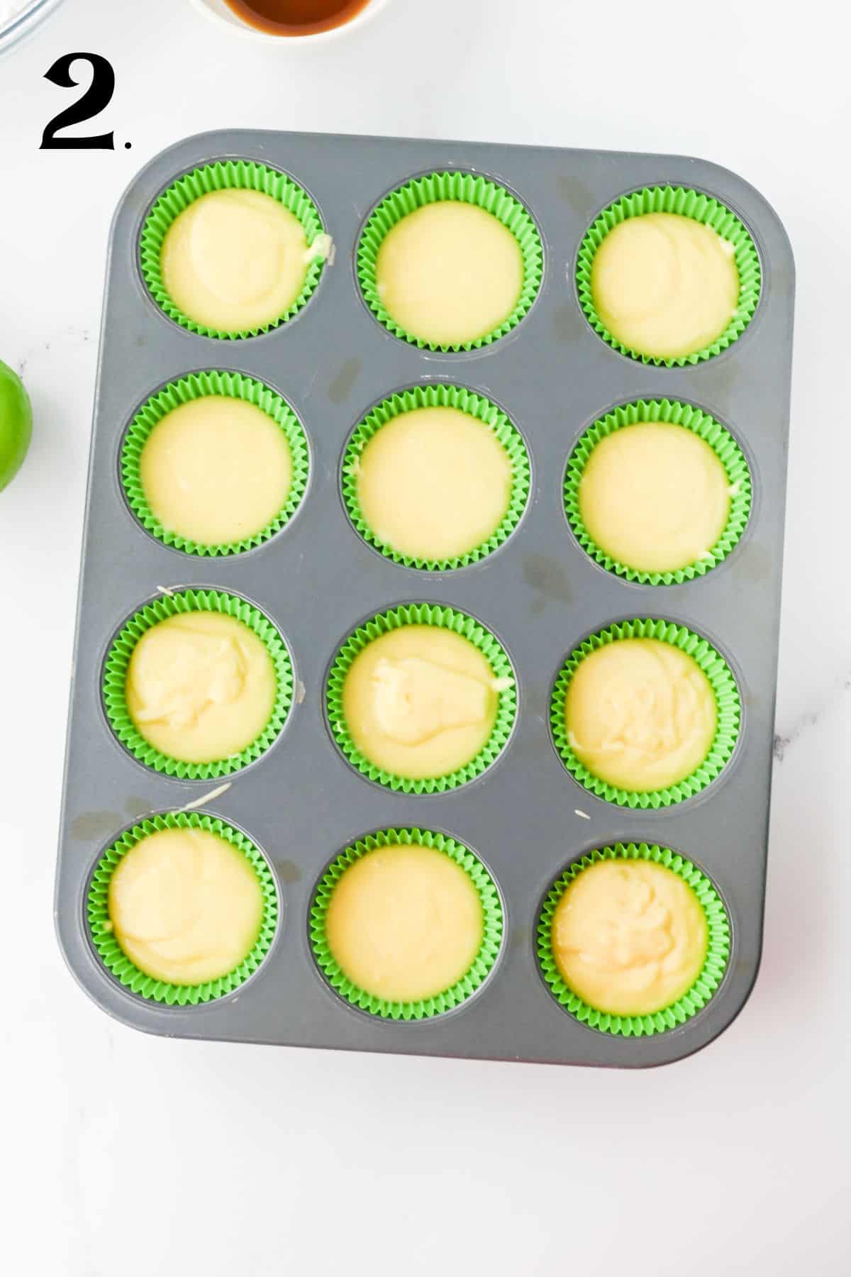 How to make Tequila Cupcakes - step 2 - pour batter in lined cupcake tin.