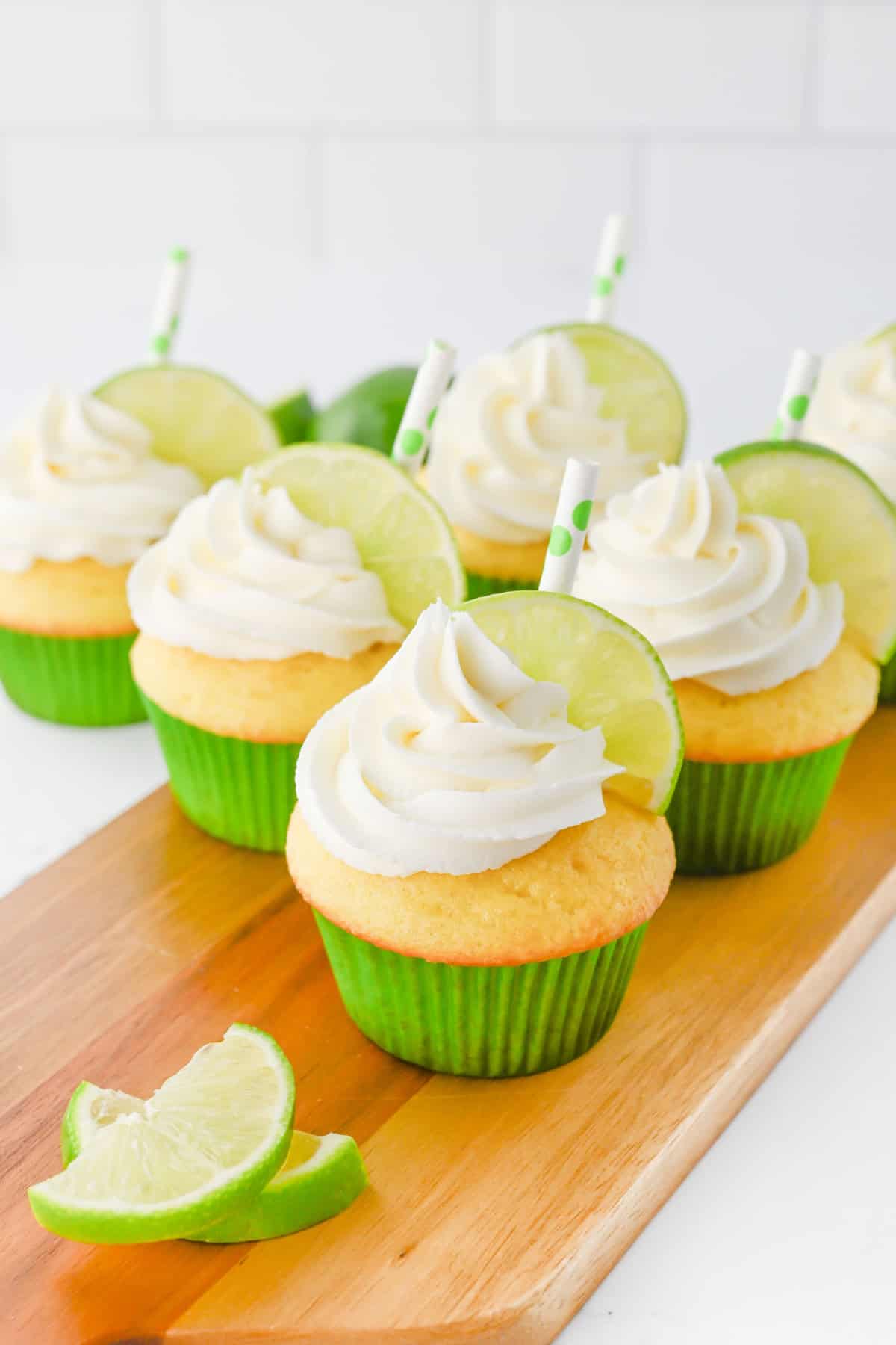 Tequila Cupcakes with limes and straws.