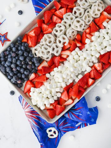 4th of July Fruit Tray with red white and blue fruit and foods.