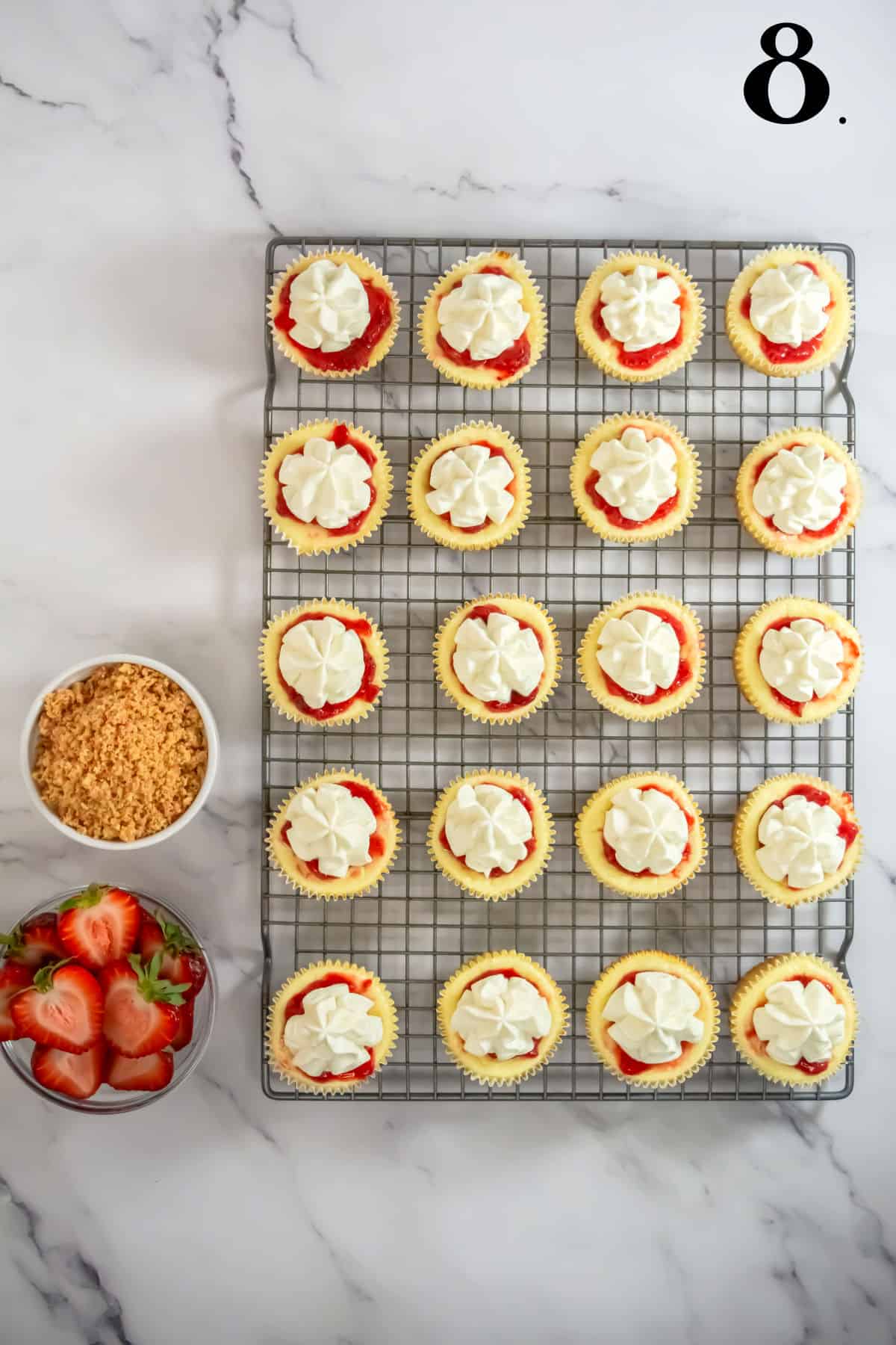 How to Make Strawberry Crunch Mini Cheesecakes - Step 8 adding whipped topping.
