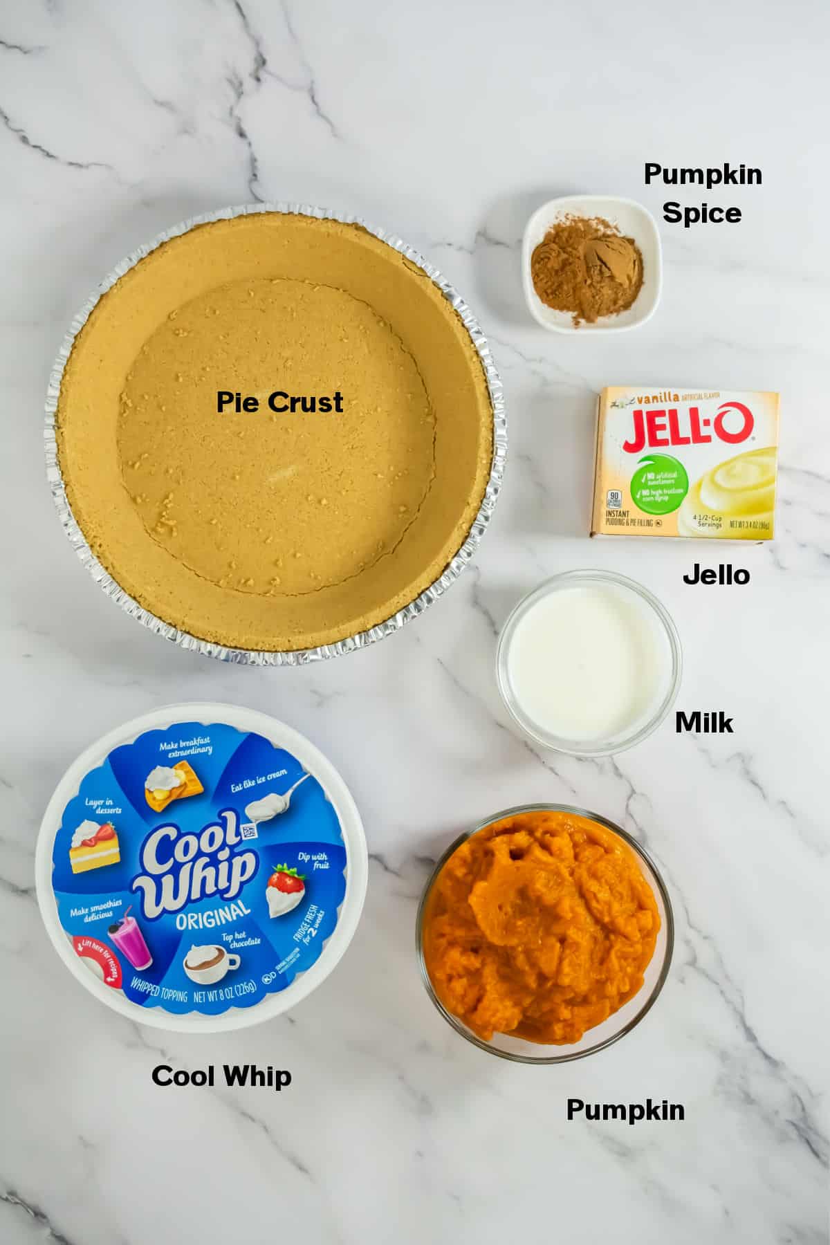 No Bake Pumpkin Pie with Cool Whip Ingredients on counter.